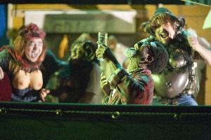 Faust (Will Badgett) drinks a potion to transform him into a young man. In the background: Witch (E.C. Kelly), Female Monkey (George Hannah), Male Monkey (Wayne Alon Scott). Photo: Jill Jones